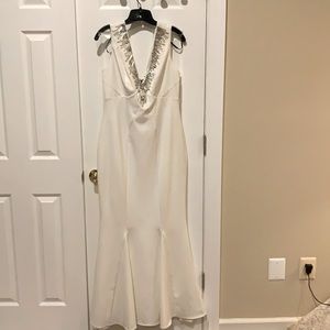 Stunning Lipsy long gown with silver rhinestone details on the neckline.